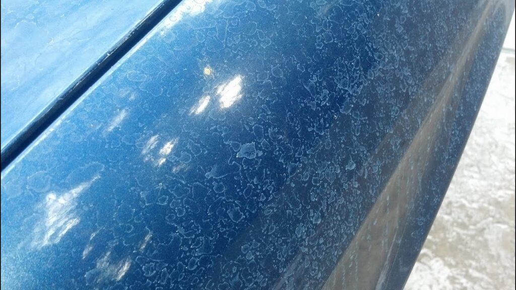 Permanent water spots and mineral etching on unprotected car paint from rain and hard water